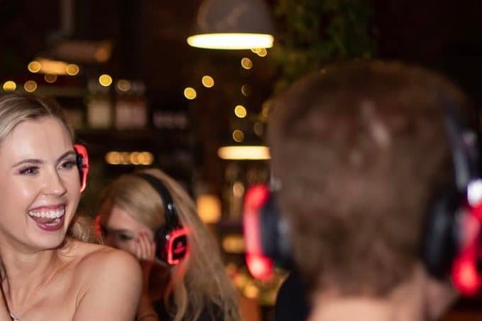 Guests dancing in glowing wireless headphones at a Melbourne silent disco
